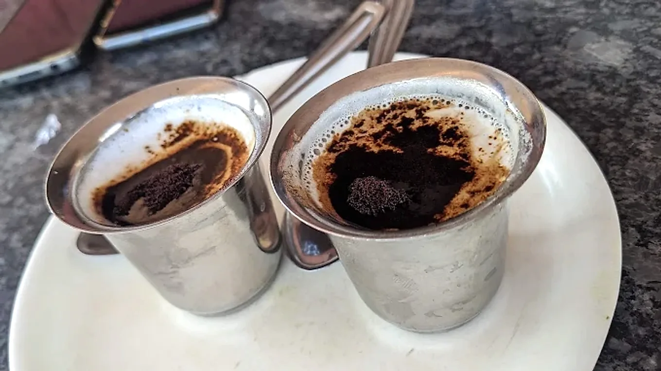 Two steel cups of strong masala tea