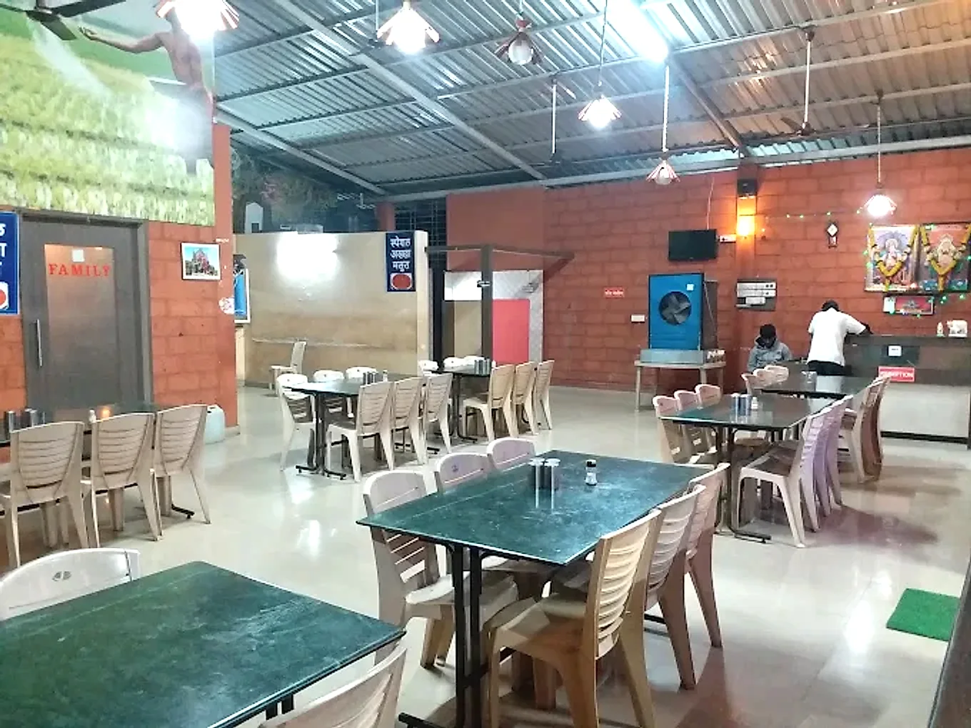 Spacious indoor dining hall at Hotel Atithi