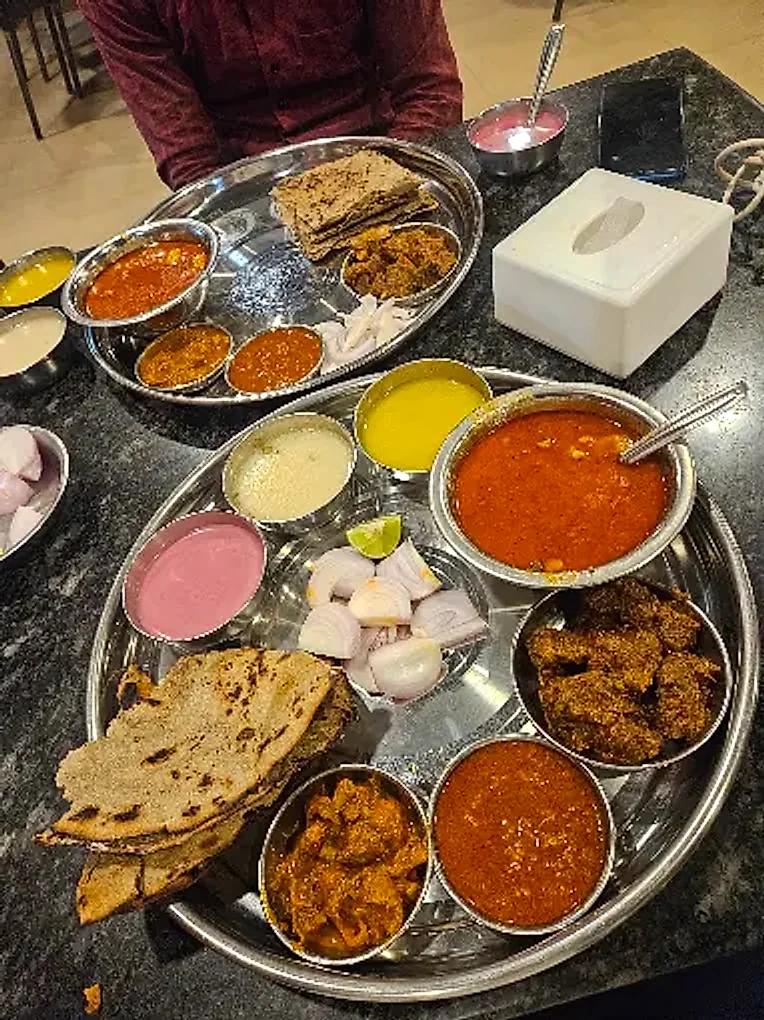 Two mutton thalis served on the table