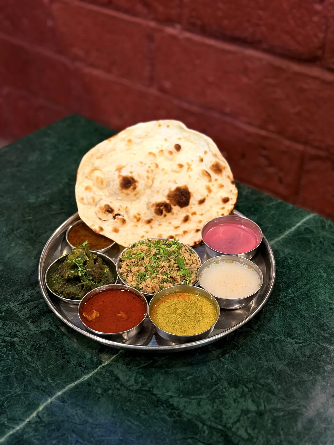 Vegetarian thali with mixed vegetables, dal, solkadhi and chapati